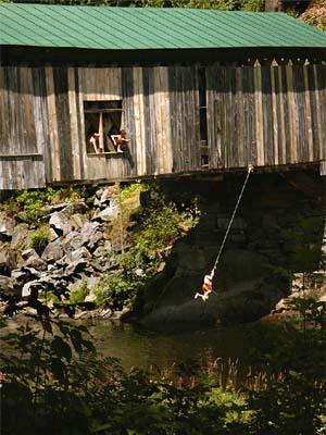 Boys Swing From A Rope On Scott Covered Bridge